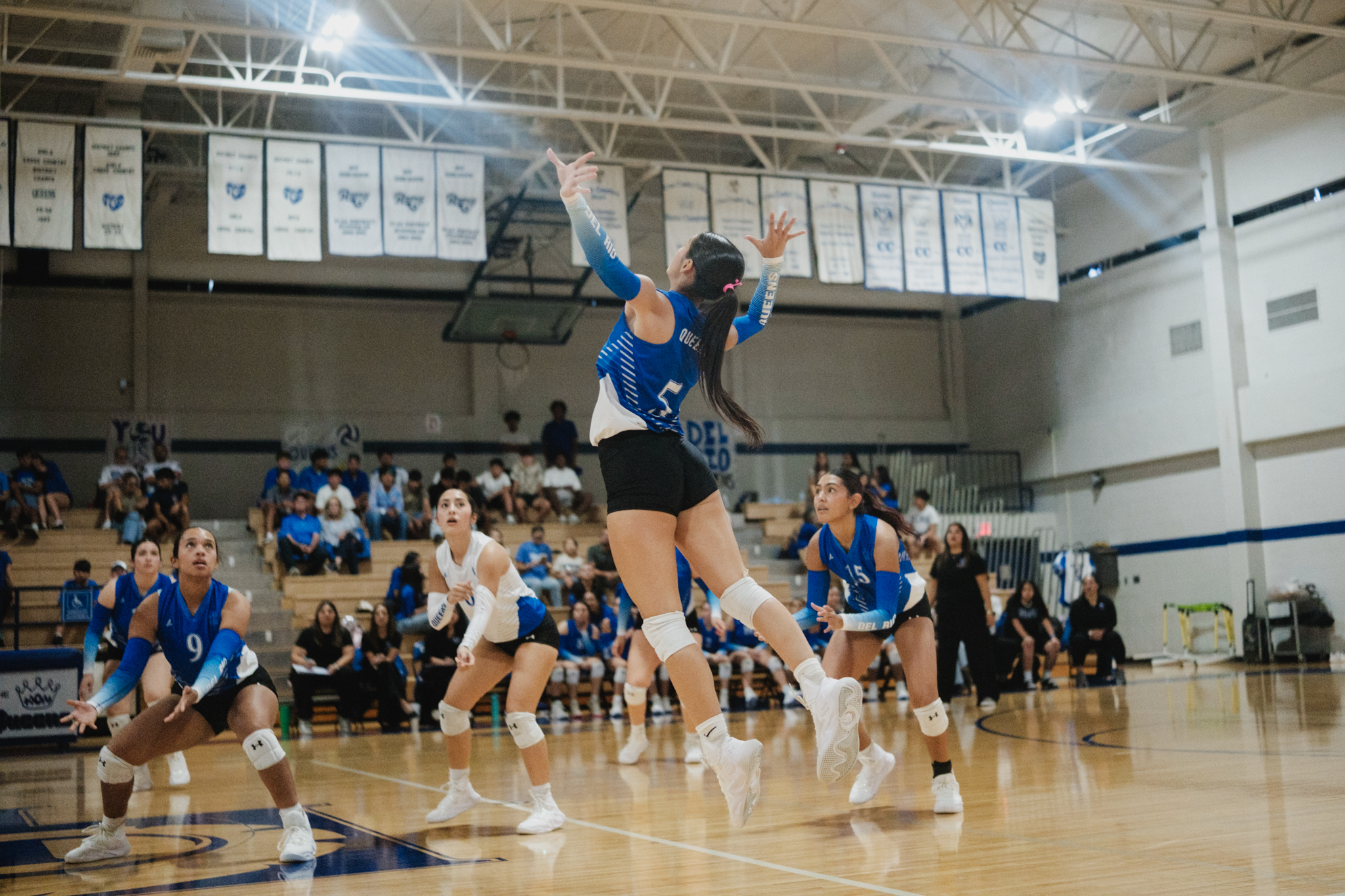 SPORTS — Queens sweep Winn, carry momentum into district play
